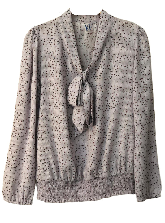 Polka dot blouse with a bow tie