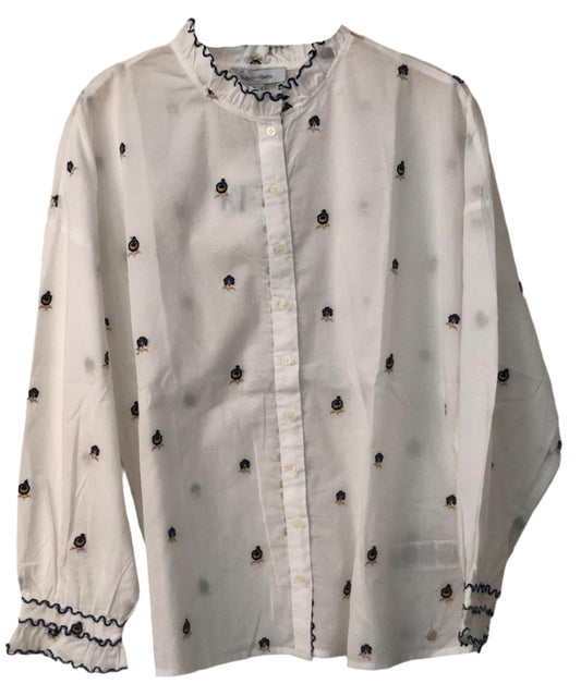 White blouse with black embellishments