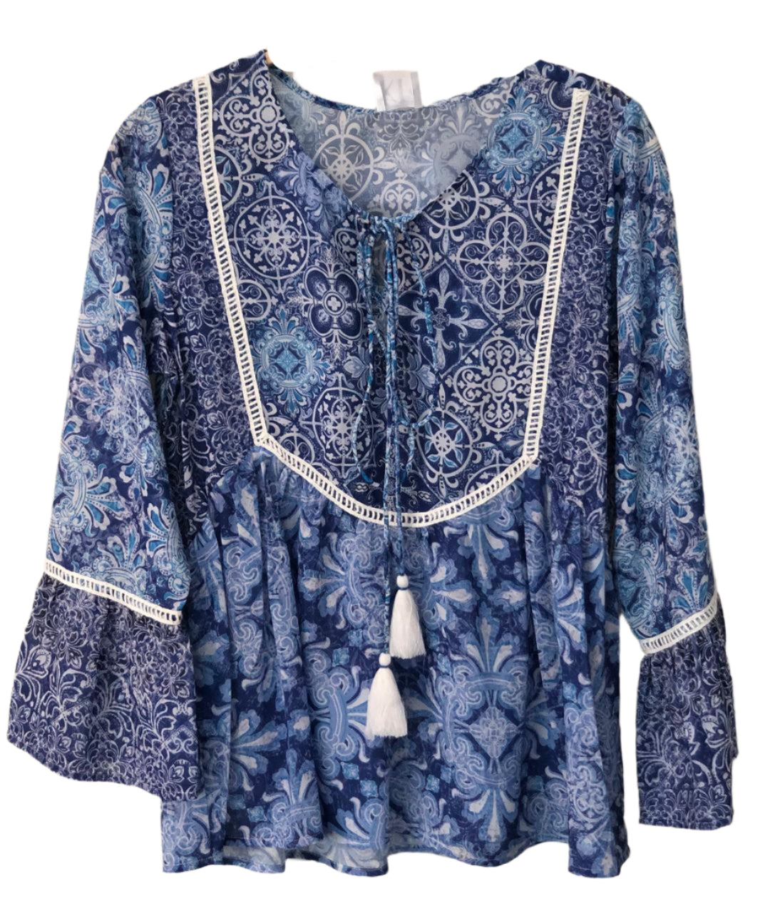Blue patterned blouse with white trim
