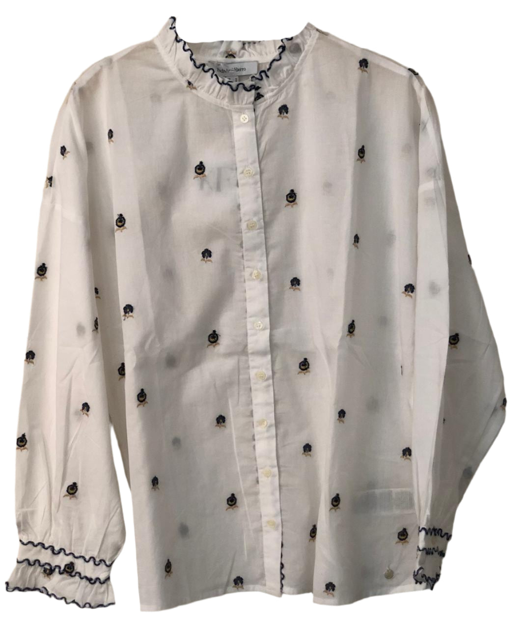 White blouse with black embellishments