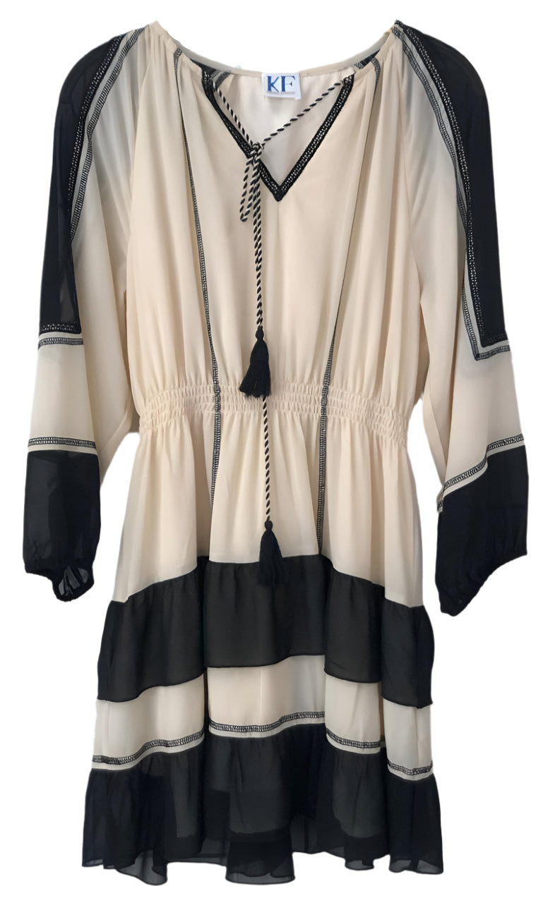 Beige and black dress with tassel detail