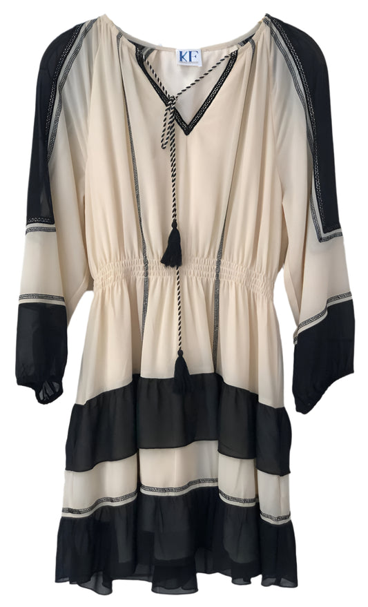 Beige and black dress with tassel detail